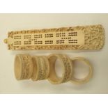 An ivory cribbage board, carved throughout,