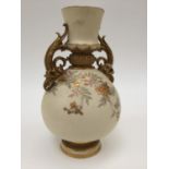 A Royal Worcester blush ivory, twin handled vase,