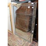 A large rectangular mirror segmented to form a mirrored frame,