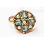 A Victorian 9ct ring, set with green stones possibly tourmaline and seed pearls,