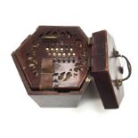 A 48 key 'squeeze box' concertina, 19th century, no makers name, mahogany casing, fretwork,