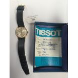 A gents gold Tissot Seastar Seven presentation watch, batons, date window and champagne dial,