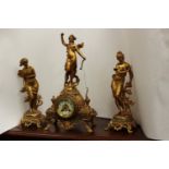 Early 20th century gilt clock with garnitures and case,