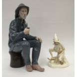 A Nao figure of a fisherman with his pipe,