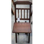 An early 20th Century folding oak child's chair