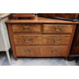 An Edwardian walnut veneered chest of drawers, comprising two short and two long drawers, 78cm high,