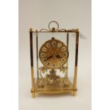 A brass Kundo anniversary clock