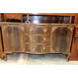 An early 20th Century mahogany sideboard, the centre of bow fronted form,