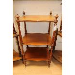 A Victorian three tier mahogany what-not, each tier raised on turned columns,