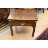 A George III style oak side table, fitted with a single drawer, standing on square legs,