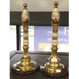 A pair of beer hand pumps decorated with hunting scenes,