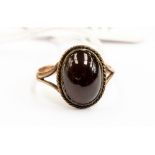 A Victorian garnet set dress ring, comprising a cabochon garnet approx size 13mm x 9mm, size Q1/2,