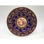 A Royal Worcester fine bone china cobalt blue and gilt overlaid plate,