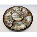 An oriental lazy Susan with ceramic dishes with oriental scenes (1)