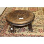 A small oak four leg stool