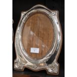 A silver Art Nouveau photograph frame made by W. J.