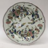 An early 19th Century faience charger, hand painted with birds,