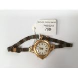 An unusual shaped watch 18k gold, converted to wristwatch from fob watch, World War One circa,