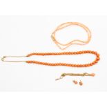 A collection of coral jewellery comprising bead necklace, 9ct gold clasp, a further necklace,