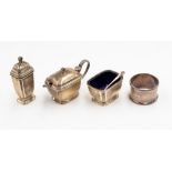 A silver pepperette, Birmingham; together with a condiment pot and spoon, another and a napkin ring,