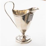 A Victorian silver cream jug with fluted sections on similar foot, London, 1882, 2.69ozt (83.