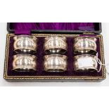 A set of six Georgian style silver plate napkin rings,