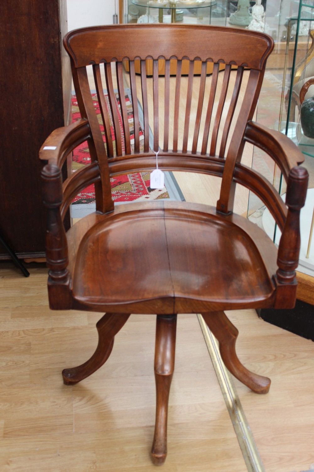 An early 20th Century mahogany Captains swivel chair,