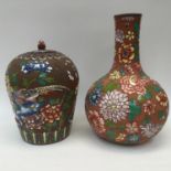 Bulbous terracotta vase, having raised glazed floral decoration,