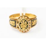 A 15ct gold, seed pearl and enamelled signet ring, with a monogrammed centre,