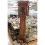 A John Drew London brass lantern clock and a later long case clock case with mechanism in separate