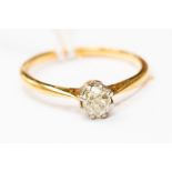 A diamond solitaire ring 18ct gold ring, the round old cut diamond weighing approx 0.