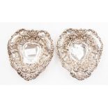 A pair of Victorian silver heart shaped ring dishes,