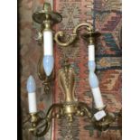 A pair of brass wall light fittings with candle style bulb holders (2)