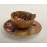 A Royal Worcester miniature teacup and saucer, painted with apples and berries, signed E.