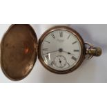 A 9ct gold Waltham pocket watch with enamelled dial and foliate engraved case,