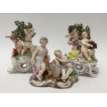 A Meissen allegorical figure group of two winged putti with drums and cornucopia (heavily restored