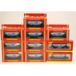 Hornby: A collection of ten boxed rolling stock coaches.