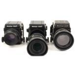 Mamiya: Two Mamiya RZ67 camera bodies together with a Mamiya RB67 camera body,