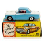 Corgi: A boxed Corgi Toys, 231, Triumph Herald Coupe, blue and white body with red interior,