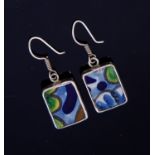 A pair of Modernist silver mounted tile earrings, glazed and painted abstract panels,