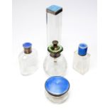 Five Art Deco enamelled silver topped glass bottles, blue and green guilloche enamel,