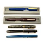 A collection of five vintage pens to include: Osmiroid 65, Conway Stewart 58, Sty pen,