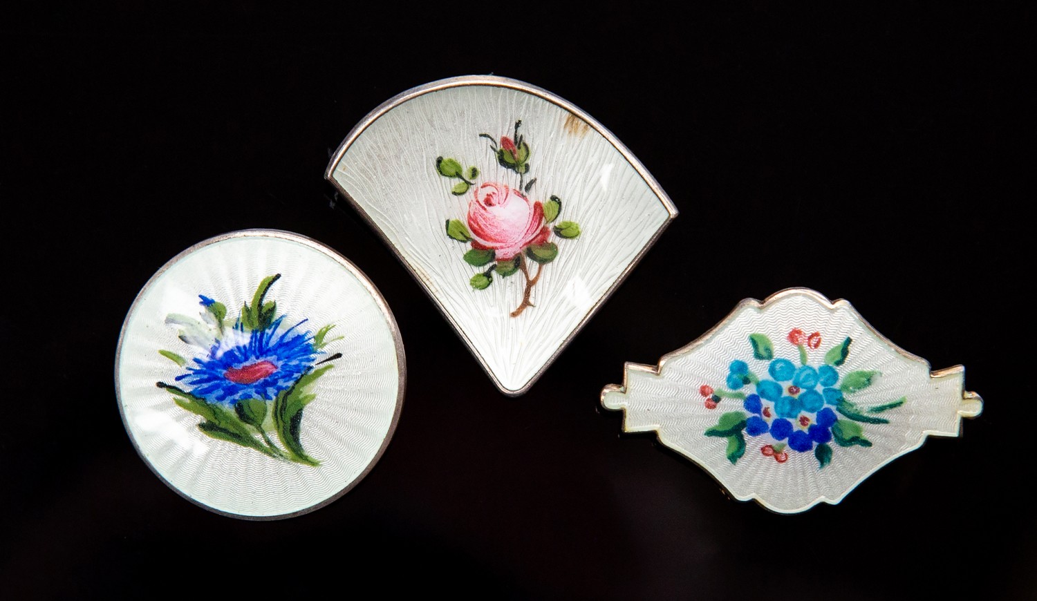 Ivar Holth, three Norwegian silver gilt and enamelled brooches,