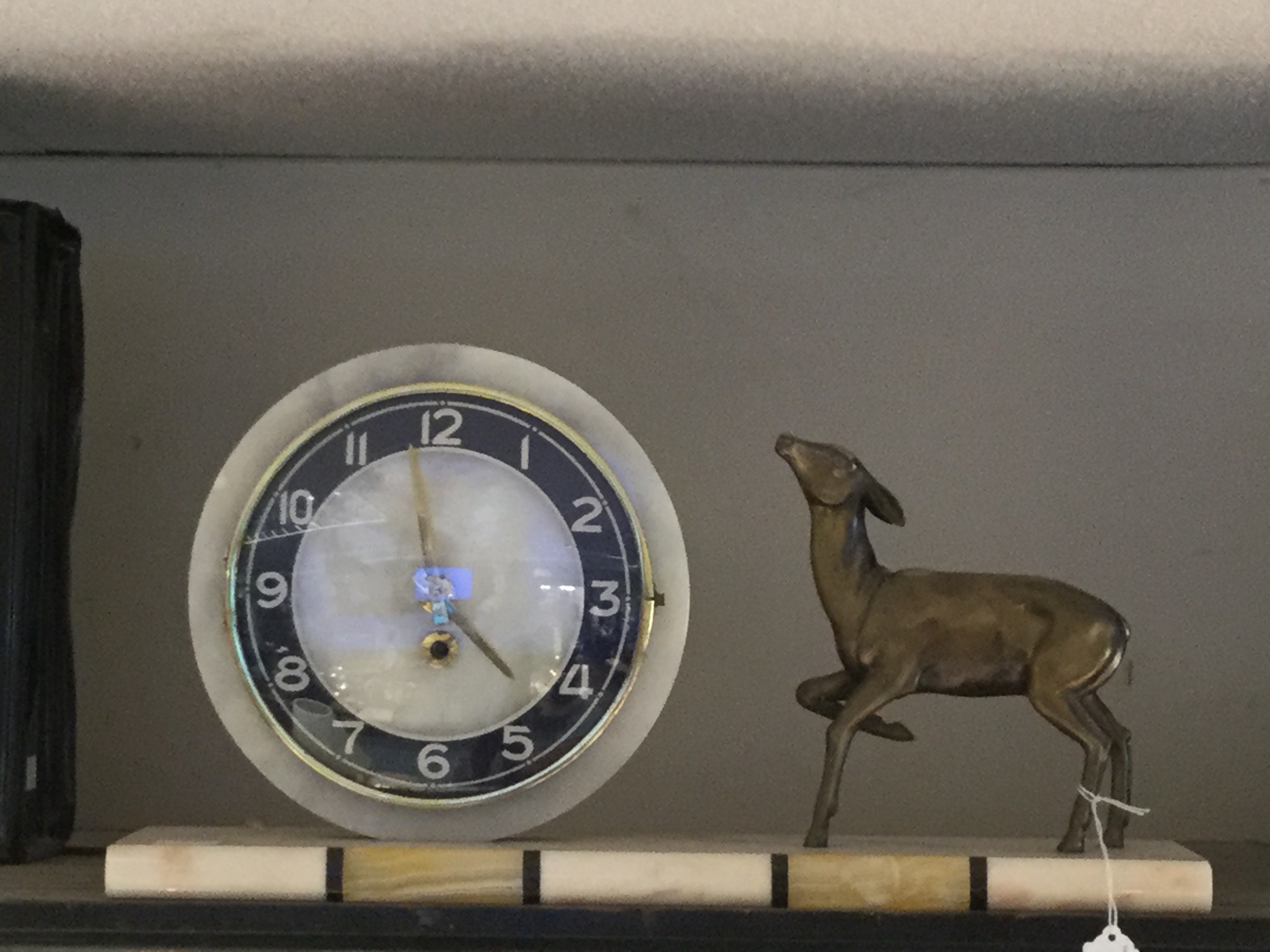 A French Art Deco marble mantle clock with deer