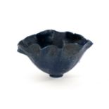 A miniature studio pottery bowl, crimped rim on foot,