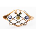 An Arts and Crafts 9 carat gold and sapphire brooch,