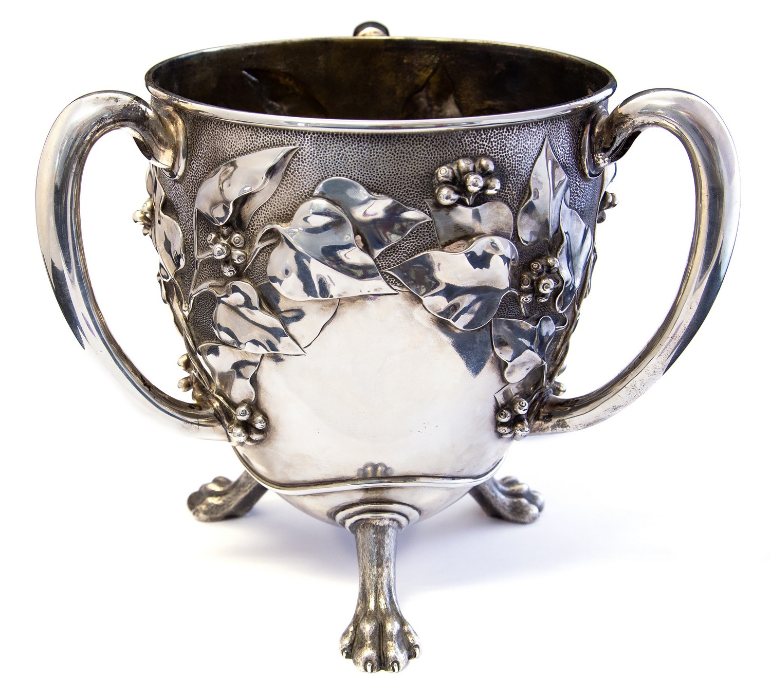 An Art Nouveau silver three-handled cup, egg form embossed in high relief with fruiting vine,