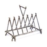 Christopher Dresser (attributed), a silver plated toast rack, six section, triangular,