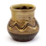 Charles Tustin for Winchcombe, a studio pottery vase, baluster form, slip decorated wave design,
