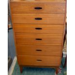 A teak Austin chest of six drawers, the top drawer with horizontal ribbing, on four tapered feet,